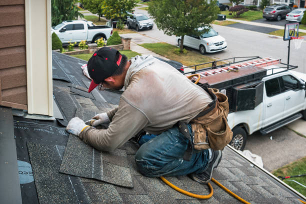 Professional Roofing technician working in Medina, WA